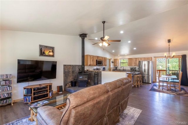 874 Hackamore Dr, Florissant, CO 80816 - living area featuring a wood stove, dark wood finished floors, a ceiling fan, lofted ceiling, and recessed lighting