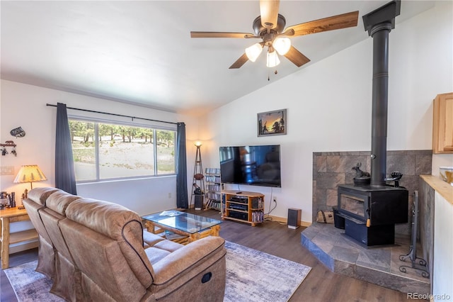 874 Hackamore Dr, Florissant, CO 80816 - living room with wood finished floors, lofted ceiling, a wood stove, and ceiling fan