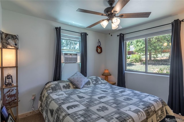 874 Hackamore Dr, Florissant, CO 80816 - bedroom featuring cooling unit, baseboards, ceiling fan, and carpet