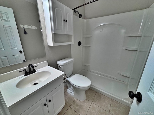 371 S Estes St Unit 10, Lakewood, CO 80226 - full bathroom featuring tile patterned flooring, a shower, toilet, and vanity