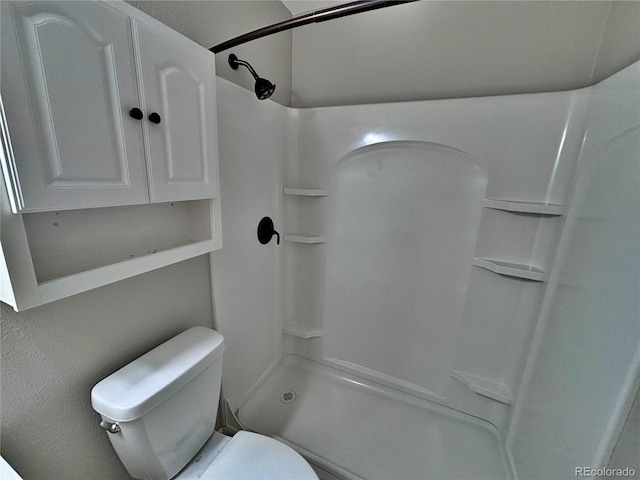 371 S Estes St Unit 10, Lakewood, CO 80226 - bathroom featuring toilet and a shower