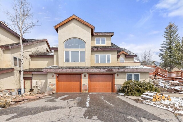 11 Hackamore Rd Unit B, Edwards, CO 81632 - view of front of home featuring an attached garage, driveway, and stucco siding