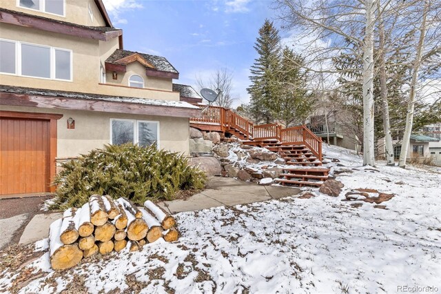 11 Hackamore Rd Unit B, Edwards, CO 81632 - snow covered property featuring stucco siding and stairs