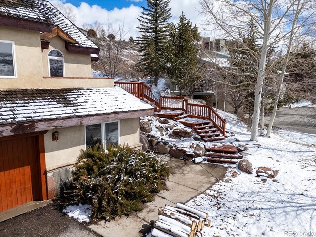 11 Hackamore Rd Unit B, Edwards, CO 81632 - view of snow covered exterior featuring stairs and stucco siding