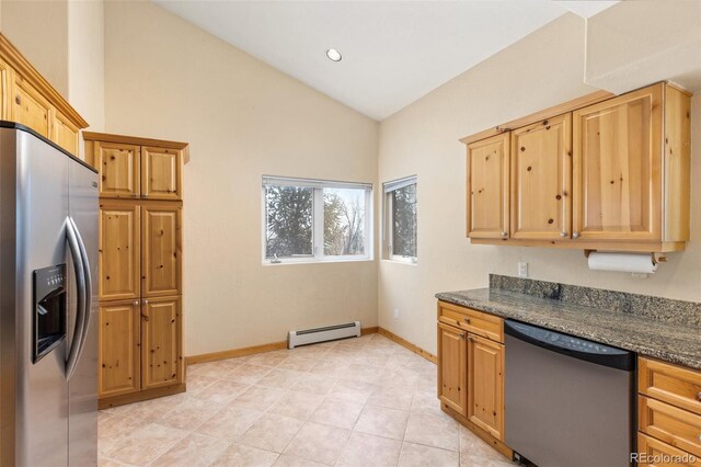 11 Hackamore Rd Unit B, Edwards, CO 81632 - kitchen with baseboards, vaulted ceiling, recessed lighting, stainless steel appliances, and a baseboard radiator