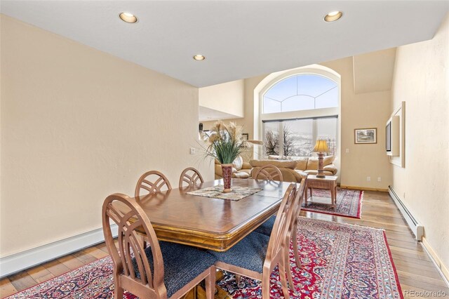 11 Hackamore Rd Unit B, Edwards, CO 81632 - dining space featuring recessed lighting, baseboards, light wood-style floors, and a baseboard radiator