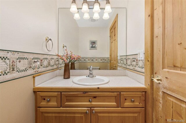 11 Hackamore Rd Unit B, Edwards, CO 81632 - bathroom featuring an inviting chandelier and vanity