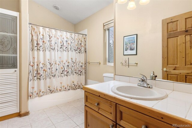 11 Hackamore Rd Unit B, Edwards, CO 81632 - full bath with shower / bathtub combination with curtain, lofted ceiling, vanity, and tile patterned flooring