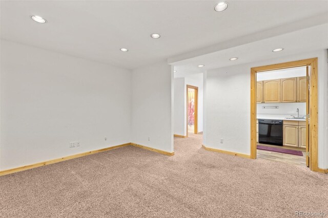 11 Hackamore Rd Unit B, Edwards, CO 81632 - unfurnished living room featuring light carpet, recessed lighting, baseboards, and a sink