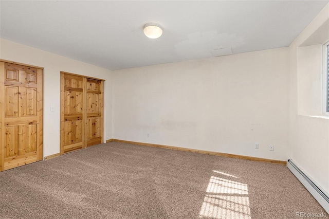 11 Hackamore Rd Unit B, Edwards, CO 81632 - unfurnished bedroom featuring baseboards, carpet floors, and a baseboard radiator