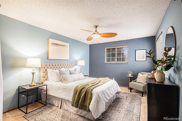 bedroom featuring ceiling fan and a textured ceiling