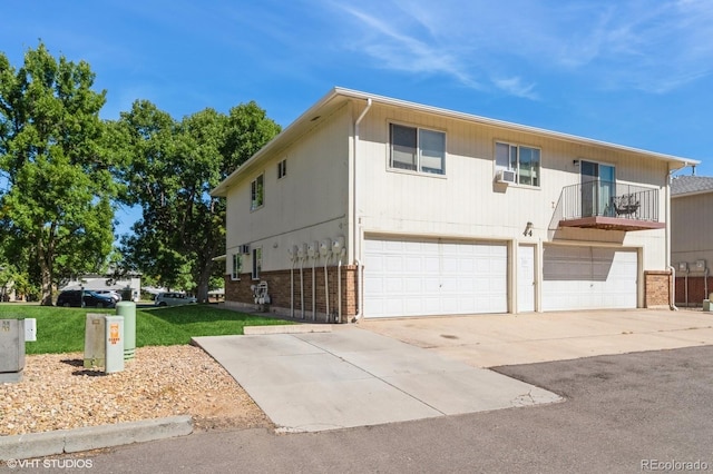 view of front of house with a front yard and a garage