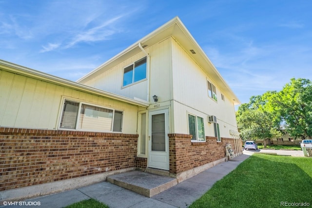 view of side of home featuring a yard