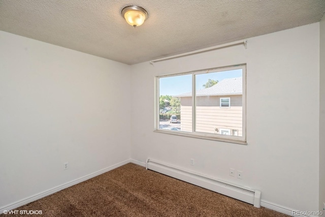 carpeted spare room featuring a textured ceiling and a baseboard radiator