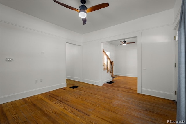 502 E San Miguel St, Colorado Springs, CO 80903 - empty room with ceiling fan, stairway, and wood finished floors