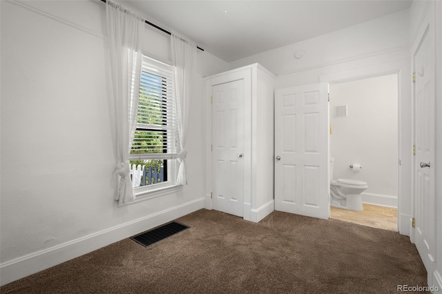 502 E San Miguel St, Colorado Springs, CO 80903 - unfurnished bedroom with carpet and ensuite bathroom