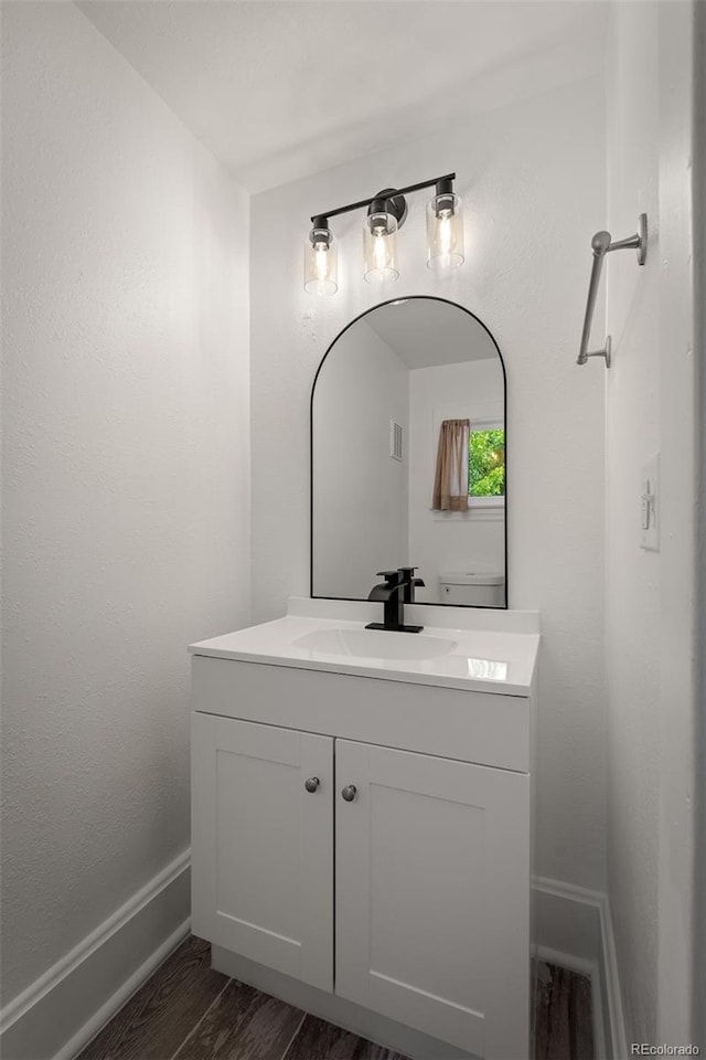 502 E San Miguel St, Colorado Springs, CO 80903 - bathroom featuring vanity and wood finished floors