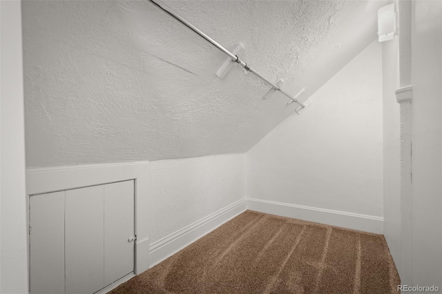 502 E San Miguel St, Colorado Springs, CO 80903 - spacious closet featuring lofted ceiling and carpet floors