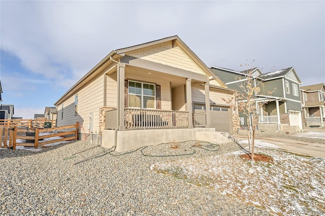 view of front of home featuring a garage and a porch