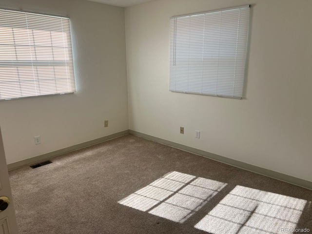 5543 Victor St, Denver, CO 80239 - spare room featuring carpet and baseboards