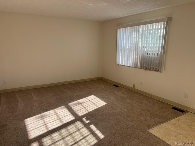 5543 Victor St, Denver, CO 80239 - carpeted spare room with baseboards