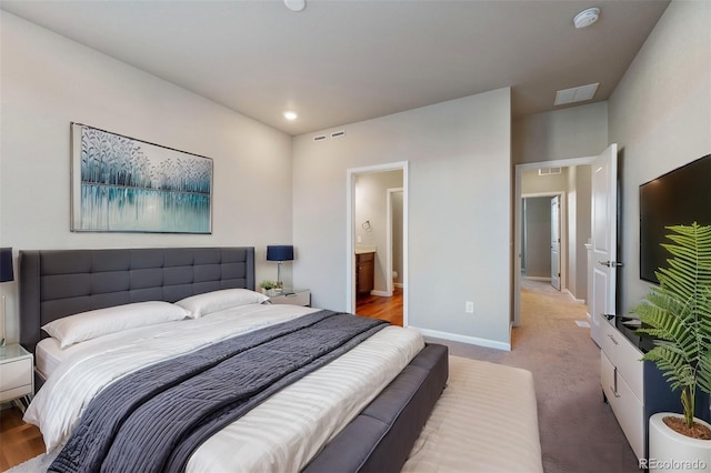 bedroom featuring carpet floors and ensuite bathroom