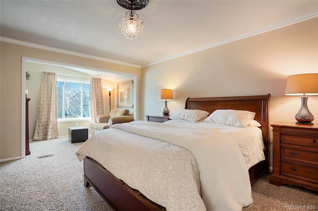 bedroom featuring ornamental molding, carpet, visible vents, and baseboards