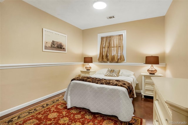 bedroom featuring visible vents and baseboards