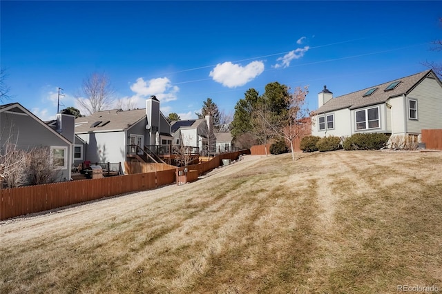 view of yard with a residential view and fence