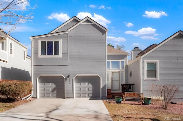 view of front of home with a garage and concrete driveway