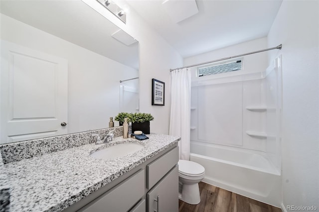 46542 Avery Ln, Bennett, CO 80102 - full bath with vanity, wood finished floors, toilet, and shower / bath combination with curtain