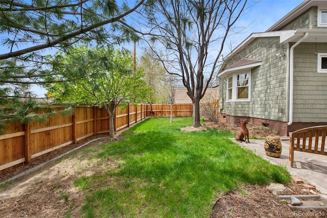 view of yard with a fenced backyard