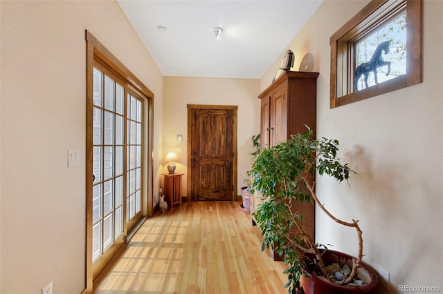 corridor with light wood-style floors