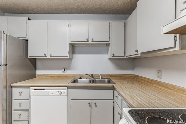 kitchen with ventilation hood, white cabinetry, sink, white appliances, and a textured ceiling