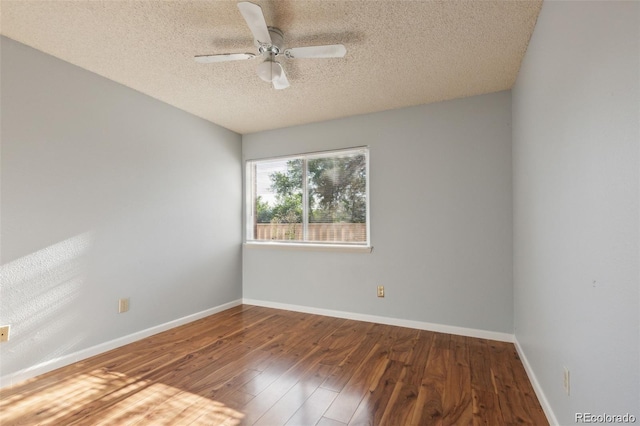 empty room with hardwood / wood-style flooring, ceiling fan, and a textured ceiling