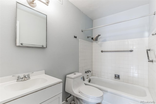 full bathroom featuring vanity, toilet, and tiled shower / bath combo