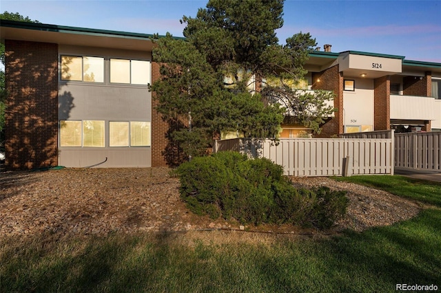 view of property exterior at dusk