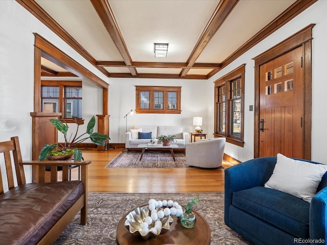 living room featuring coffered ceiling, wood finished floors, beam ceiling, and baseboards