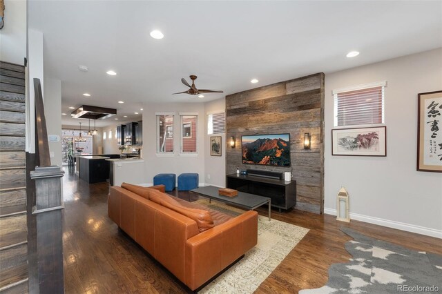 living room featuring stairs, baseboards, dark wood-style floors, recessed lighting, and a ceiling fan