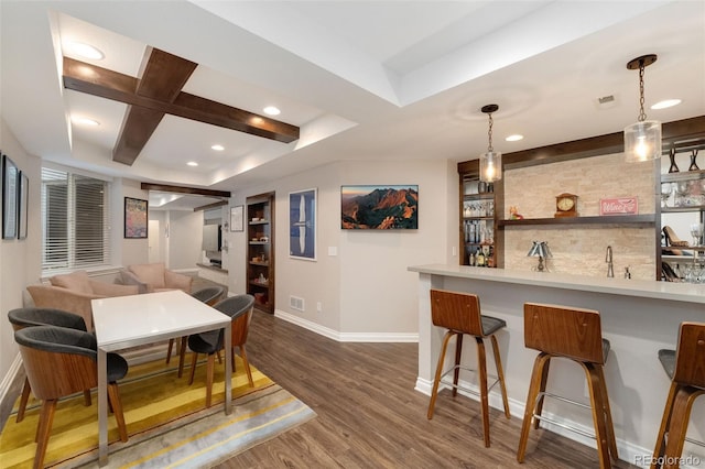 bar with wet bar, decorative light fixtures, wood finished floors, baseboards, and recessed lighting