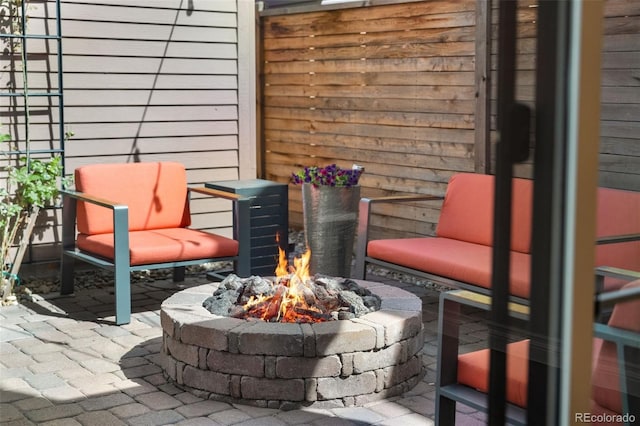 view of patio with a fire pit