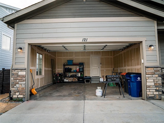 garage featuring driveway