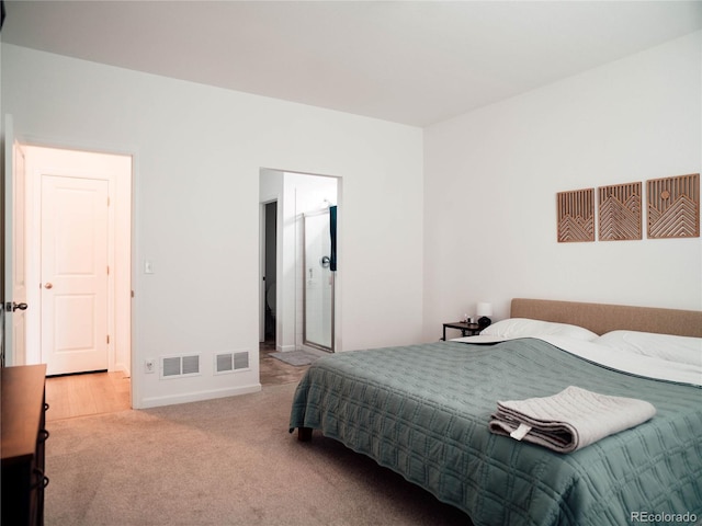 carpeted bedroom featuring visible vents and baseboards