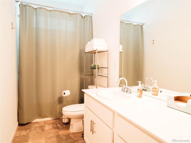full bathroom with vanity, toilet, and a shower with shower curtain