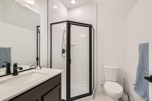 6791 Navajo Ct, Denver, CO 80221 - bathroom featuring toilet, vanity, a stall shower, tile patterned flooring, and baseboards