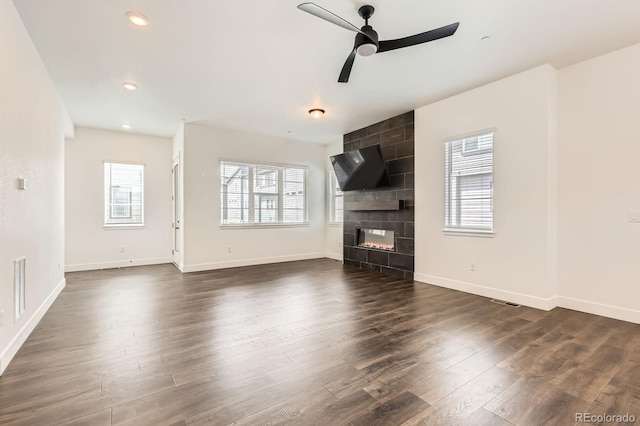 6791 Navajo Ct, Denver, CO 80221 - unfurnished living room with dark wood-style flooring, a ceiling fan, a fireplace, baseboards, and recessed lighting