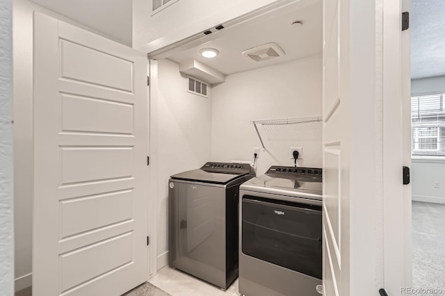 6791 Navajo Ct, Denver, CO 80221 - laundry area featuring washer and dryer and baseboards