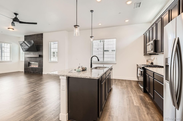 6791 Navajo Ct, Denver, CO 80221 - kitchen with a sink, stainless steel appliances, a ceiling fan, dark wood-style flooring, and baseboards