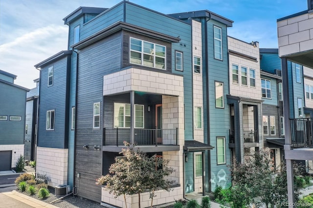 6791 Navajo Ct, Denver, CO 80221 - townhome / multi-family property with central AC and a balcony