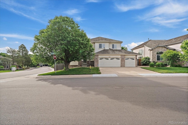 9602 Indian Wells Dr, Lone Tree, CO 80124 - view of front of property featuring a garage, driveway, and brick siding